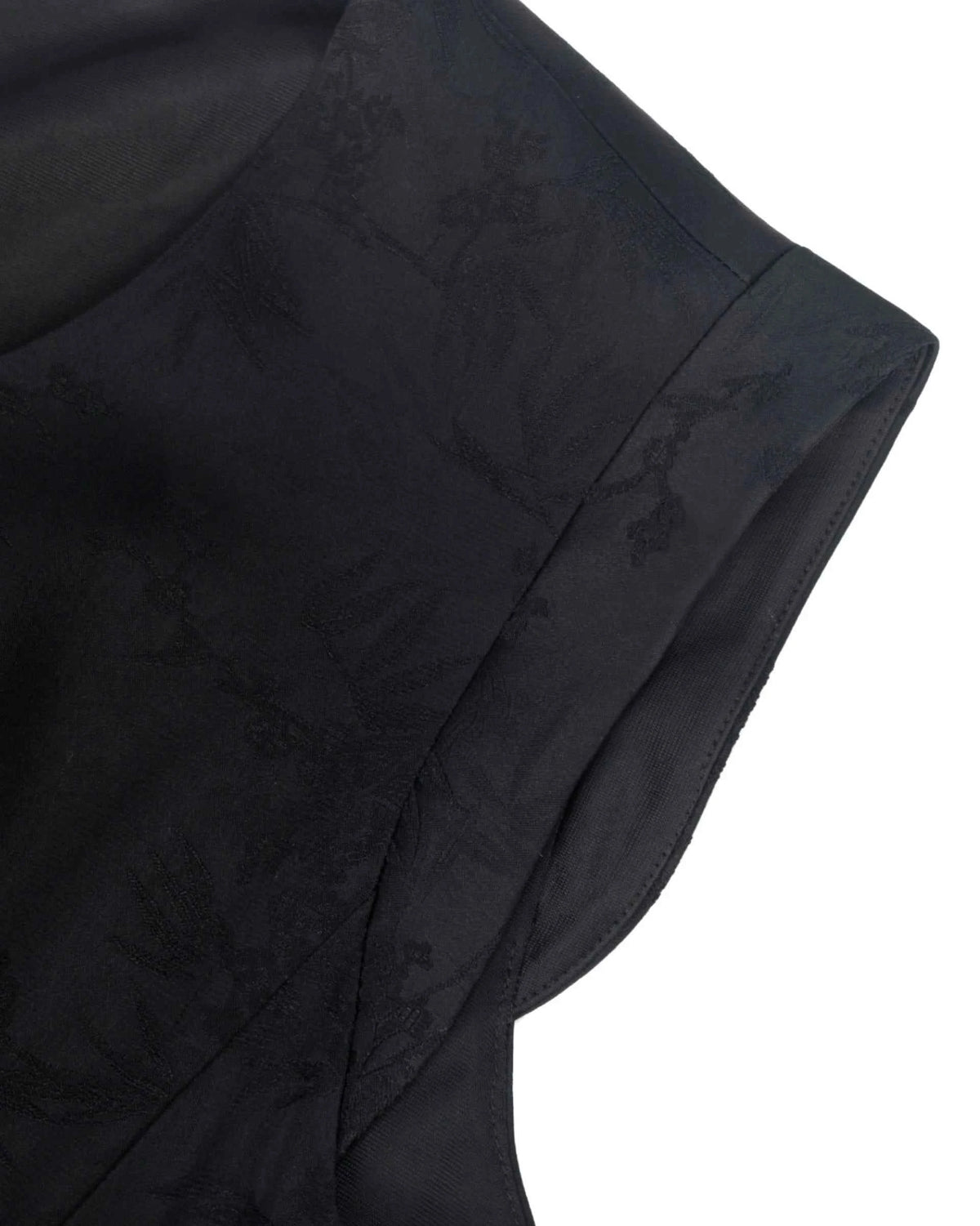 The shoulder extends slightly above the arm opening, with a clean edge following its curve.