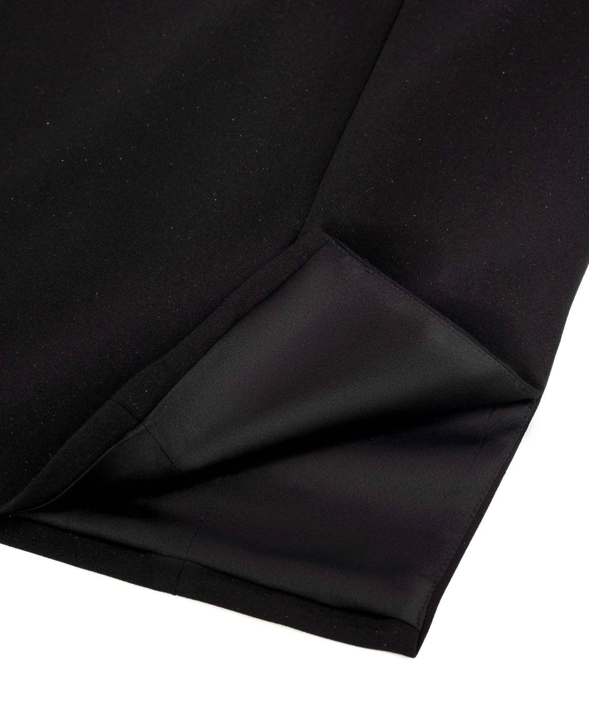 The close view reveals overlapping dark surfaces beside a neatly finished edge.