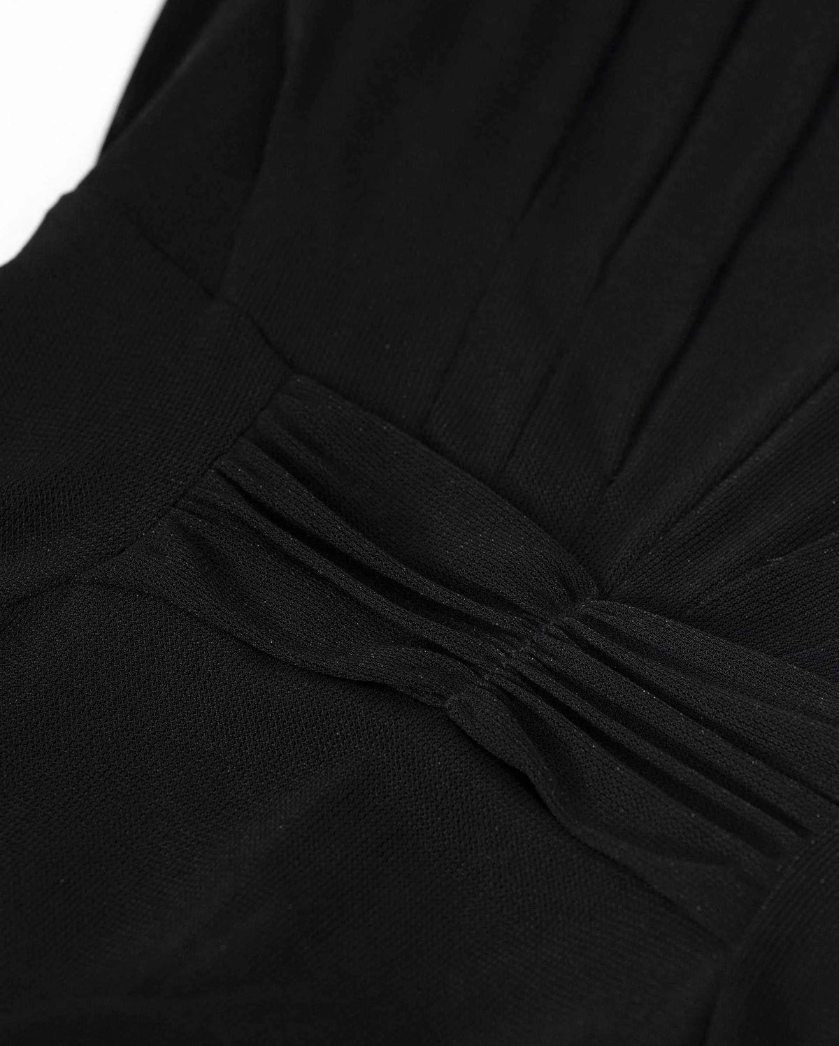 Narrow folds meet across the waist, changing direction beneath the upper bodice.