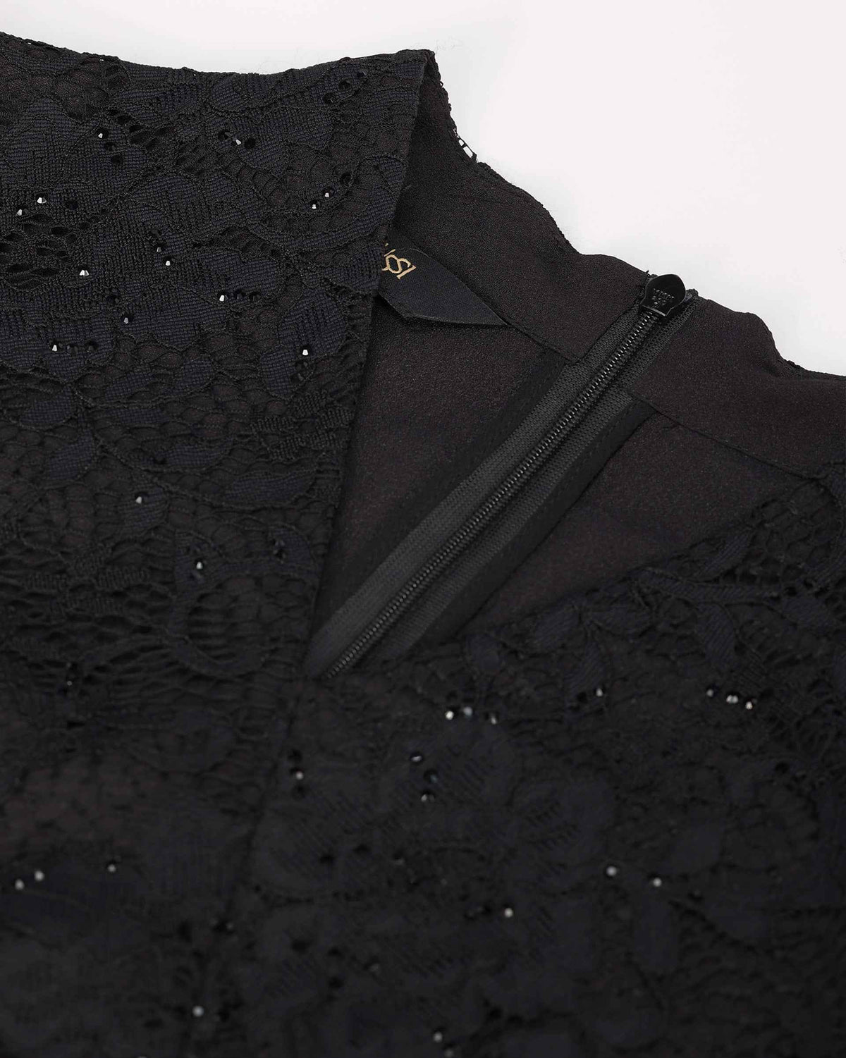 The upper detail shows the shaped neckline and fastening beside floral lace.