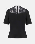 Chinese-inspired short-sleeve blouse with a tailored waist