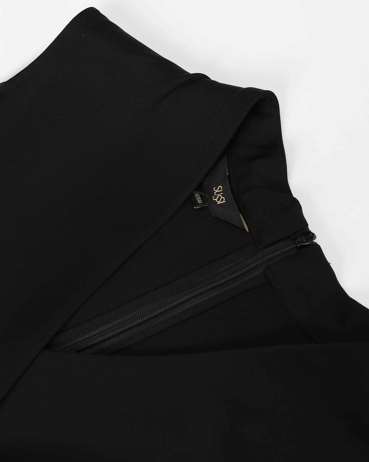 The close view reveals the upper edge and fastening beside smooth black fabric.