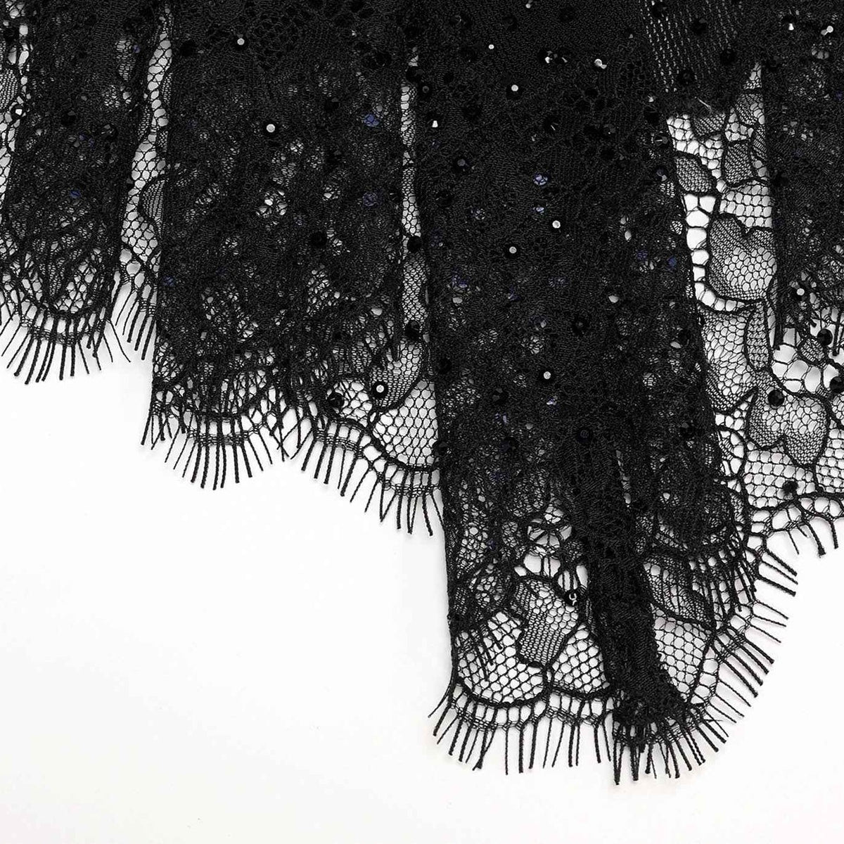 The lace border continues along the coat's uneven, draped lower edges.