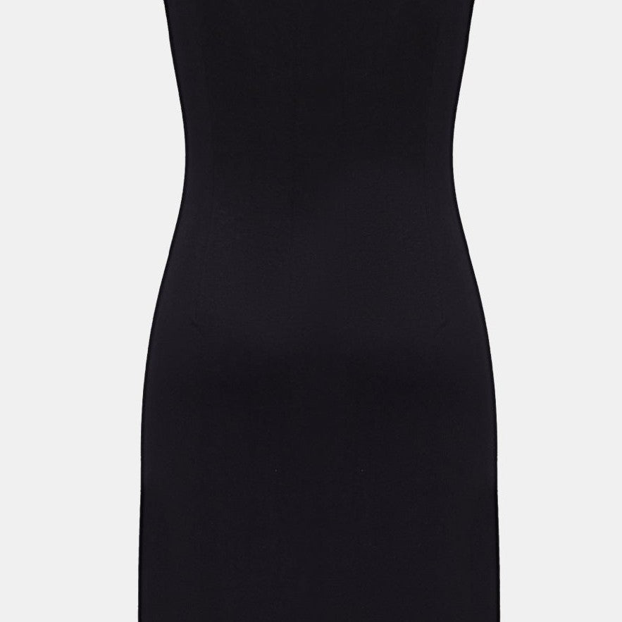 The close back view reveals smooth fabric narrowing through the waist before continuing into the skirt.